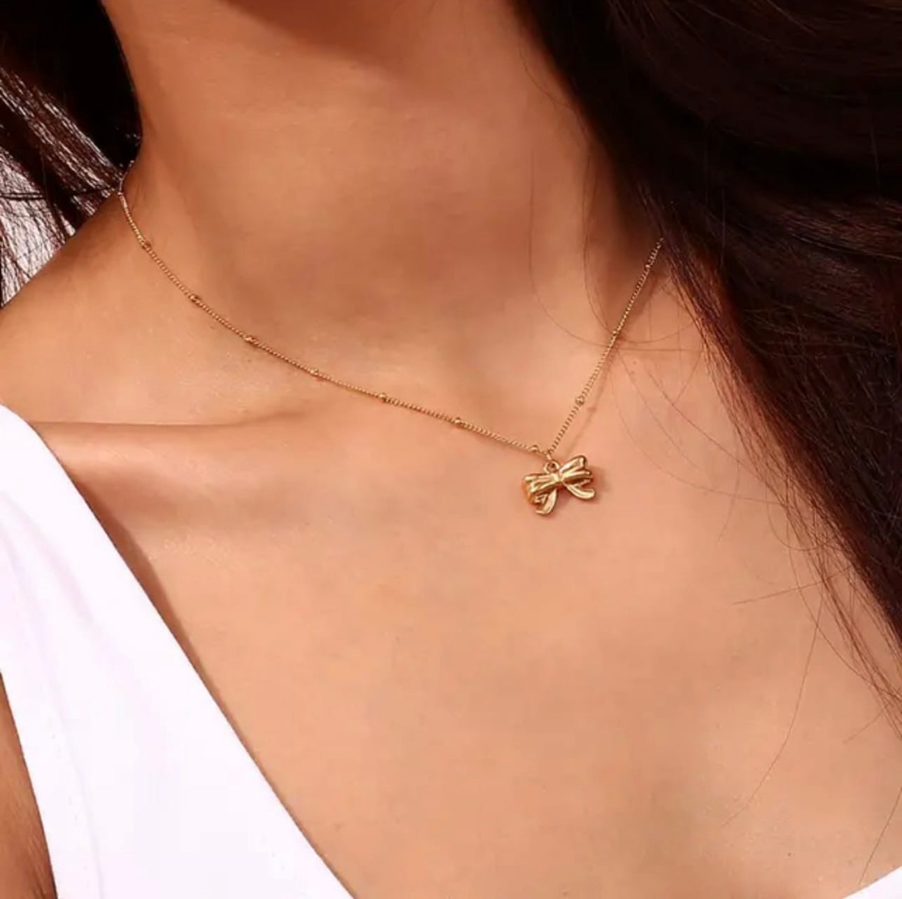 Golden Bow Pendant Necklace – Elegant Charm