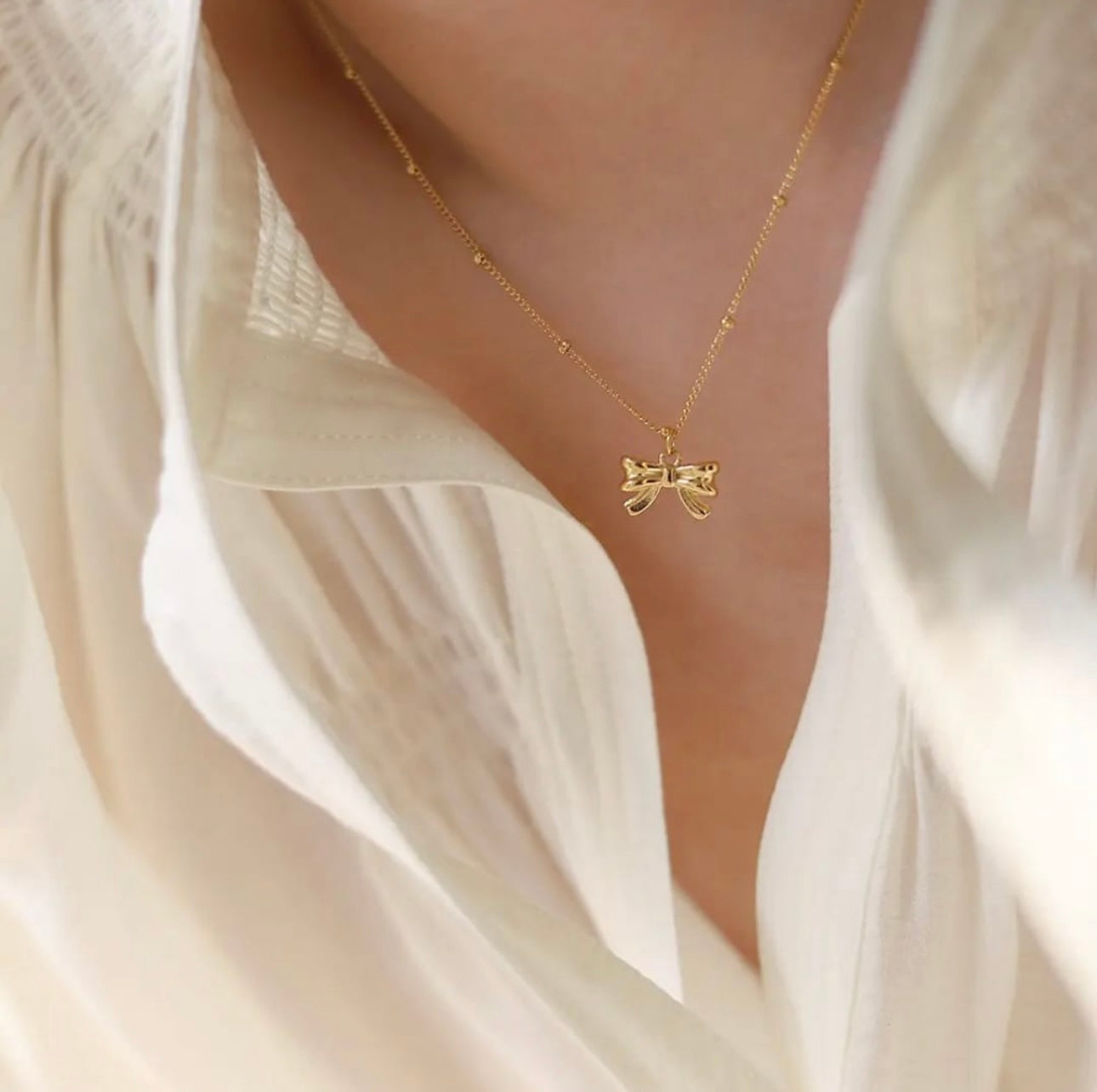 Golden Bow Pendant Necklace – Elegant Charm